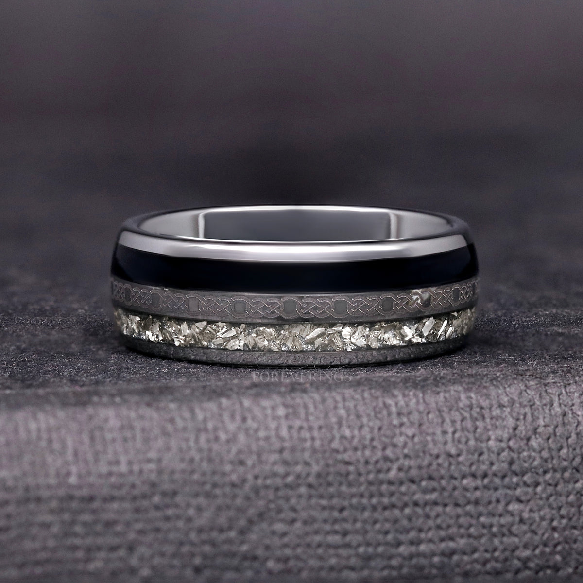 Polished 8mm silver tungsten band shown straight on with black, Celtic knot and crushed stone stripes