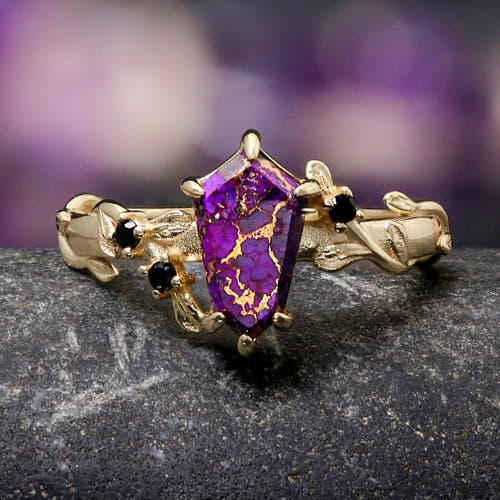 Women's gold sterling silver engagement ring with a kite-cut purple turquoise and leaf vine band