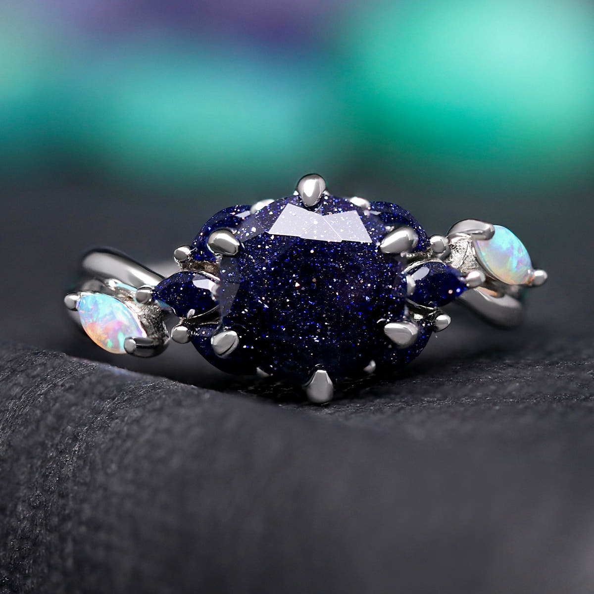 Great Rift nebula sandstone ring in sterling silver, front view of the faceted center stone