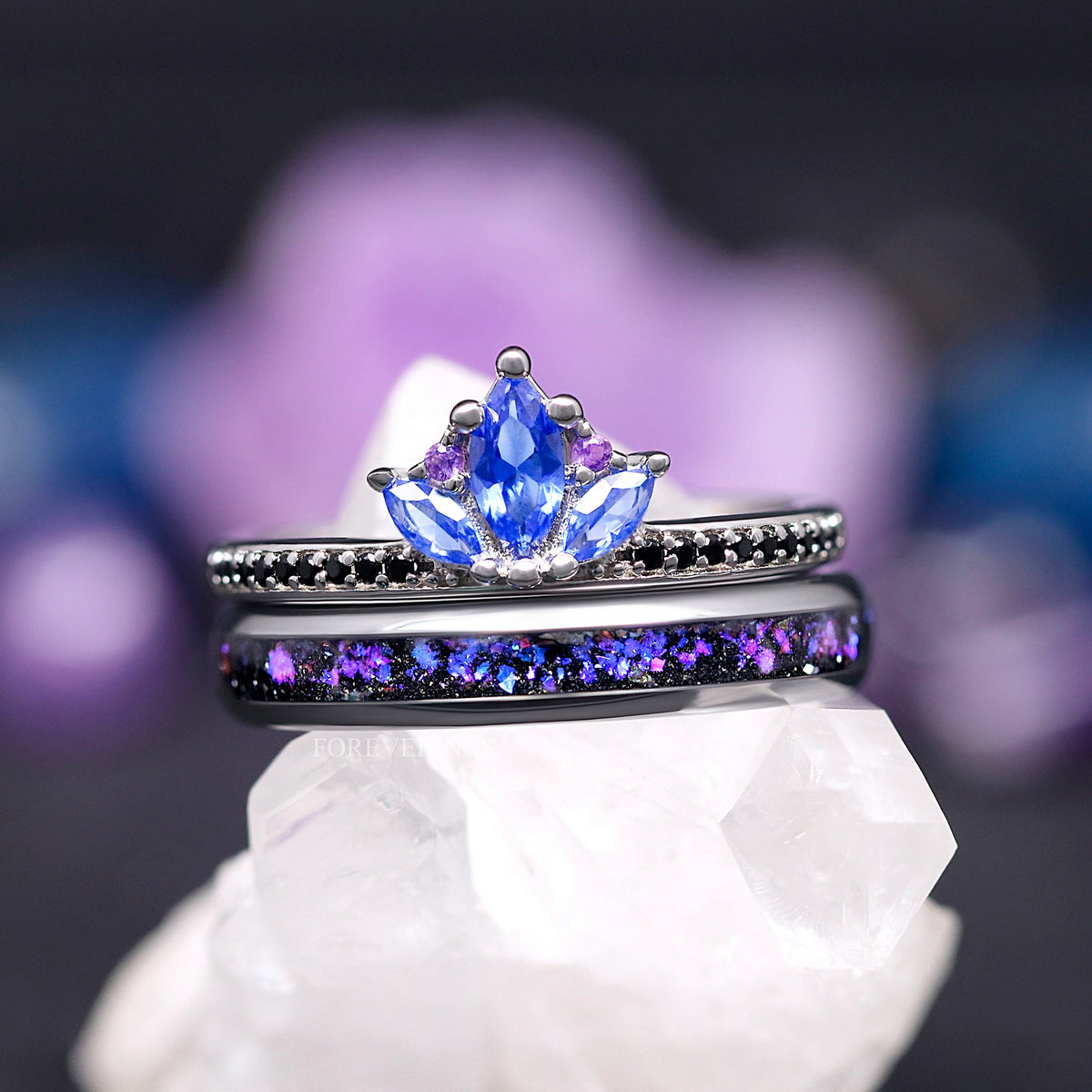 Lotus sapphire ring stacked on a thin silver band with nebula sandstone inlay, front view