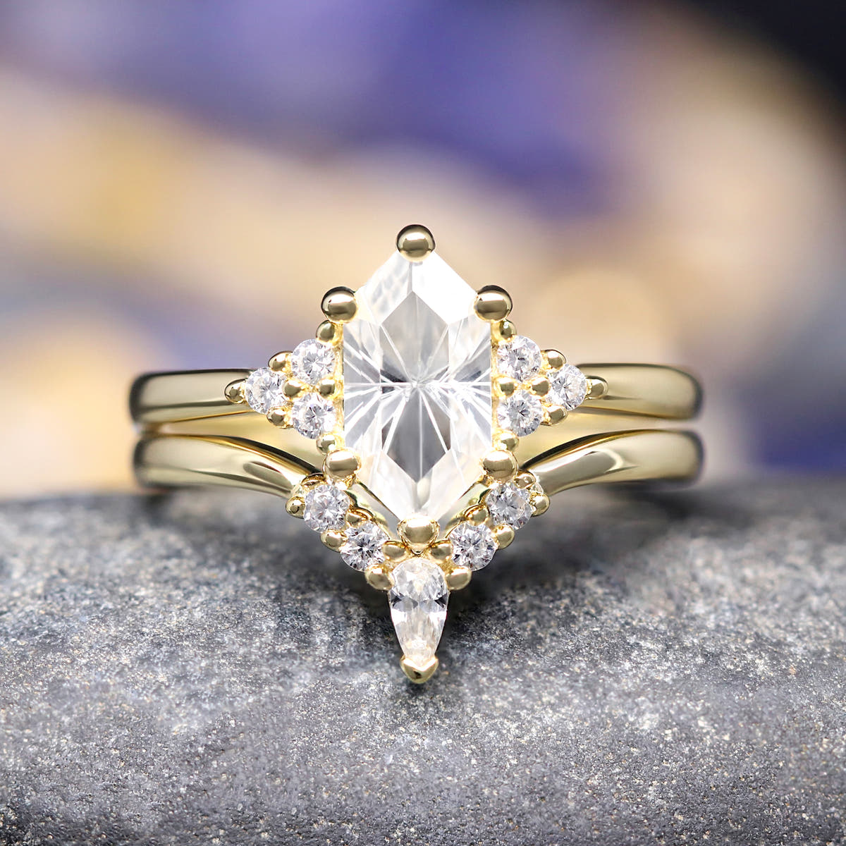 Women's gold sterling silver white sapphire engagement ring with a curved band, straight on