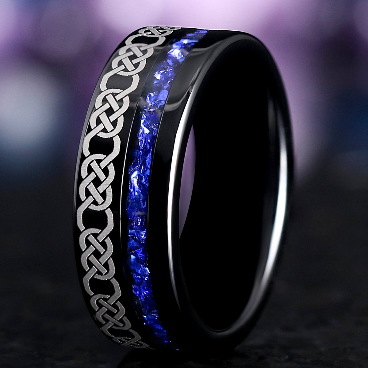 Men's 8mm black tungsten Celtic knot wedding band with a blue sapphire stone inlay