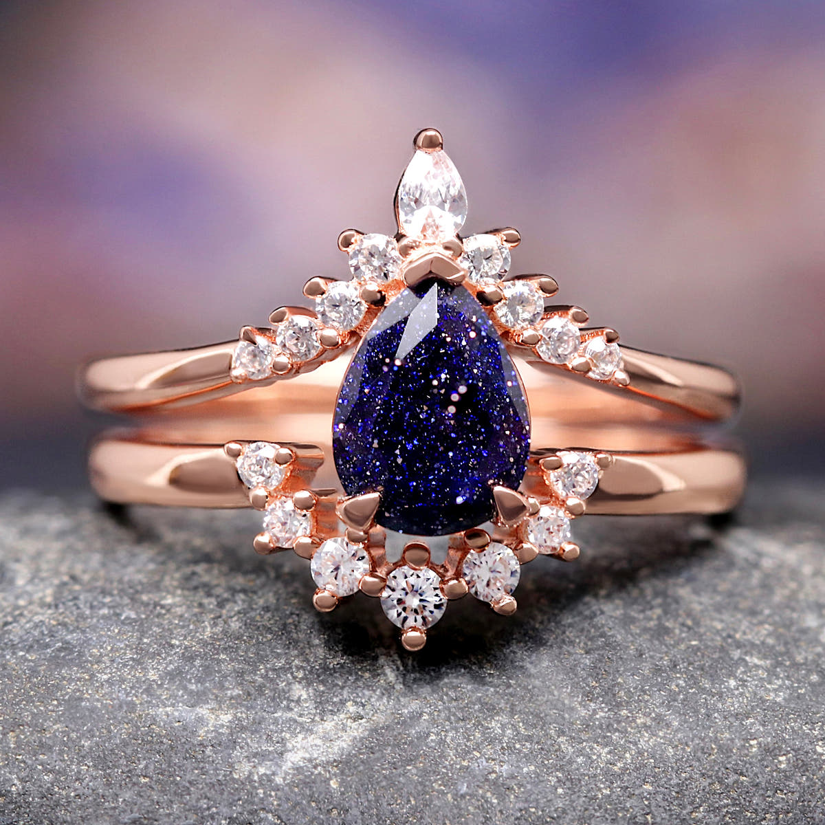 Rose gold sterling silver bridal set with a pear cut blue sandstone and crown-style band