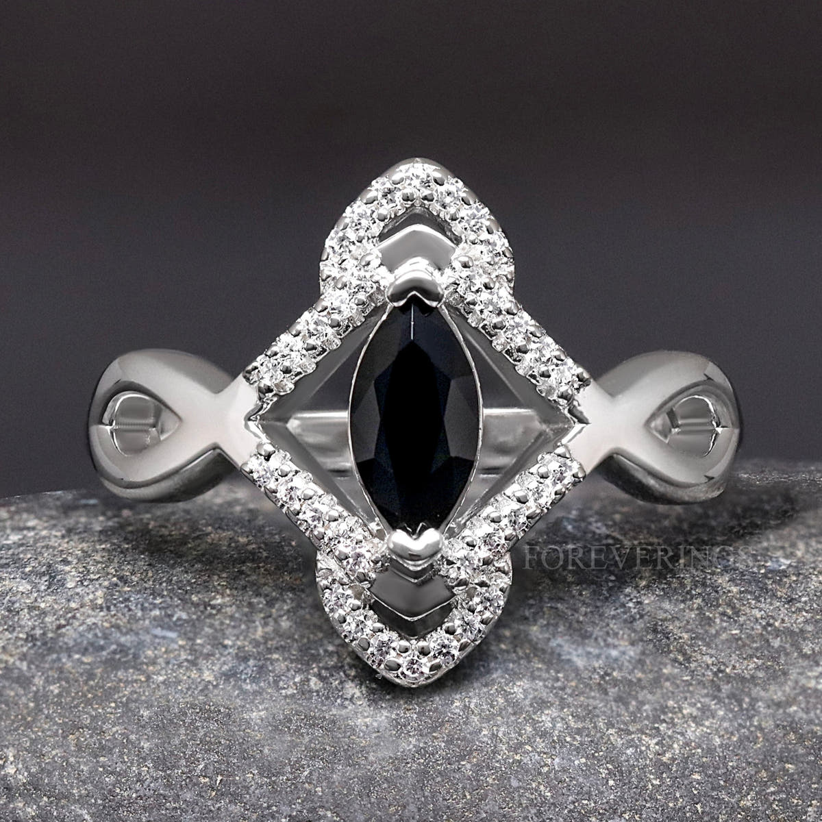 Women's sterling silver Celtic engagement ring with a marquise black center stone, close top view