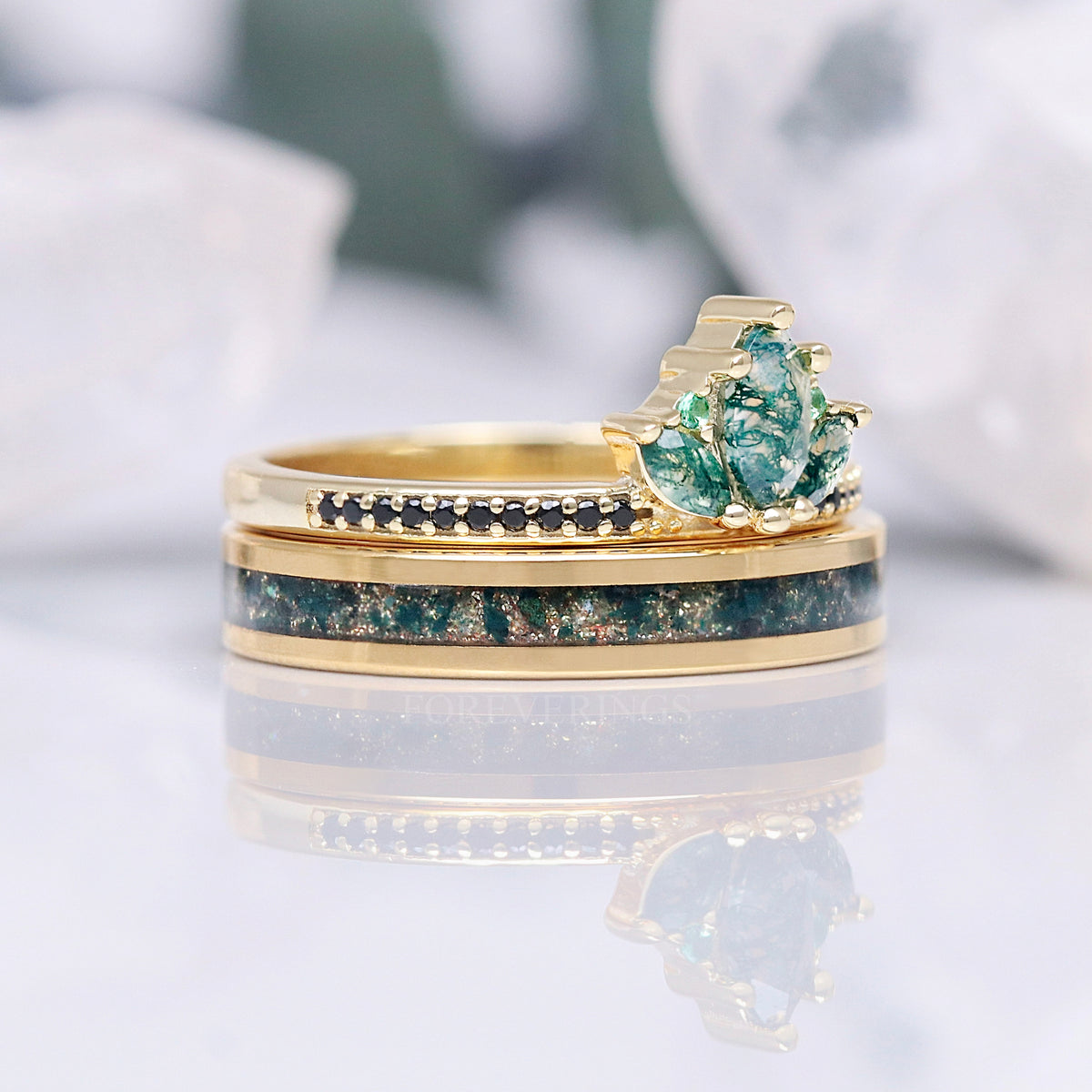 Moss agate lotus ring stacked on a 4mm gold moss agate inlay band, front view