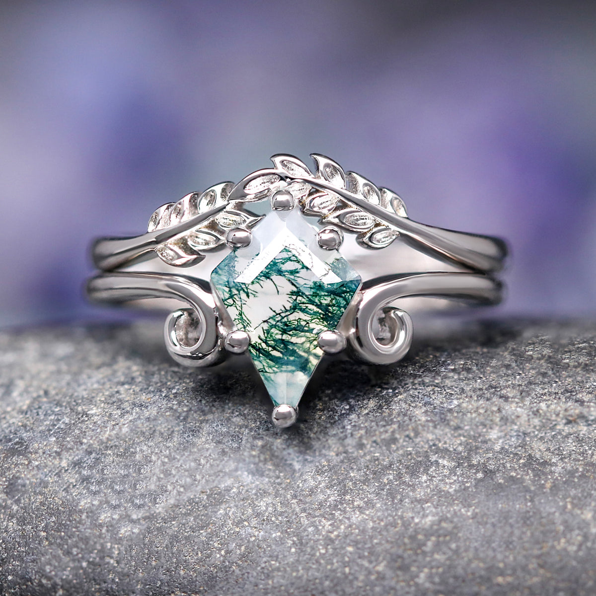 Women's sterling silver kite-cut moss agate bridal set with leaf band and swirl details, front view