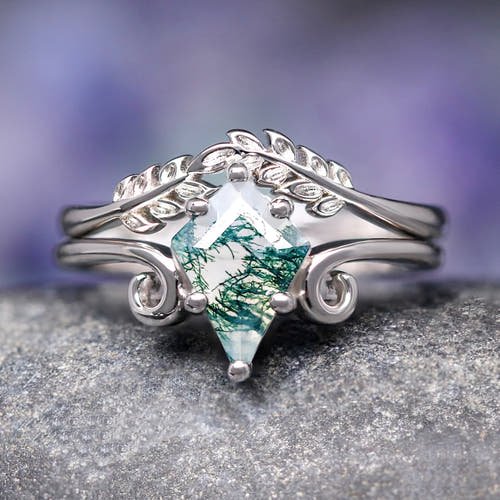 Women's kite-cut moss agate engagement ring set in sterling silver with a leaf band, close front view