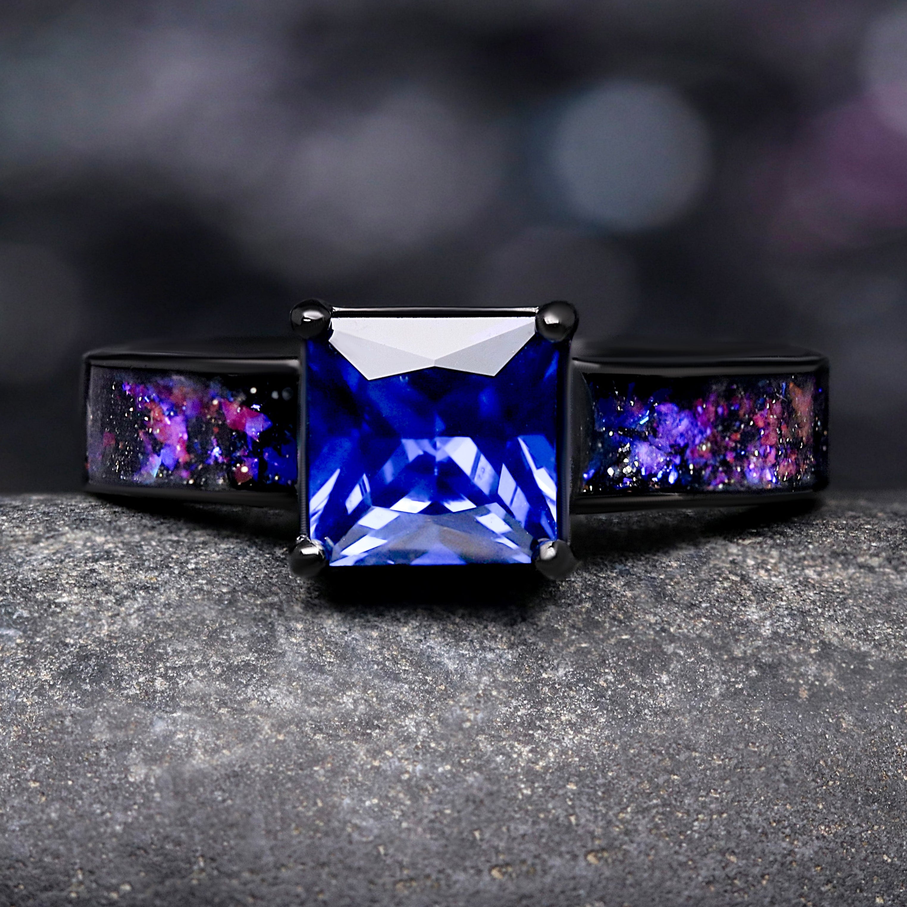 Ring with a blue gemstone on a dark background