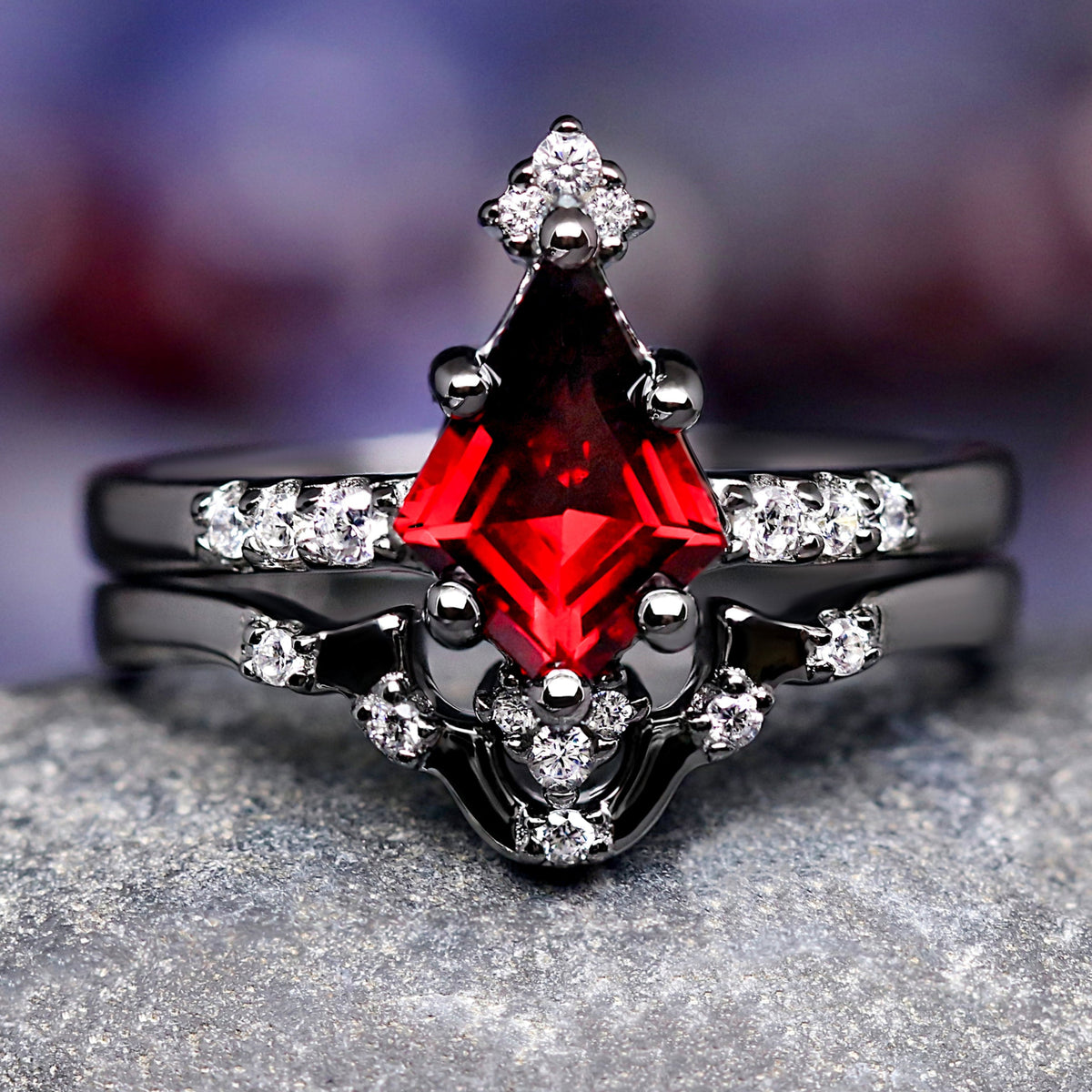 Gothic kite-cut garnet bridal set in black sterling silver with a curved band, front view