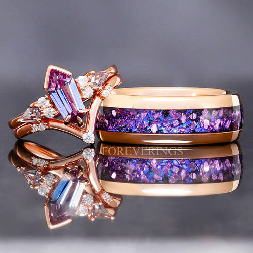 Matching rose gold couples ring set, alexandrite engagement ring beside an 8mm tungsten band with alexandrite inlay