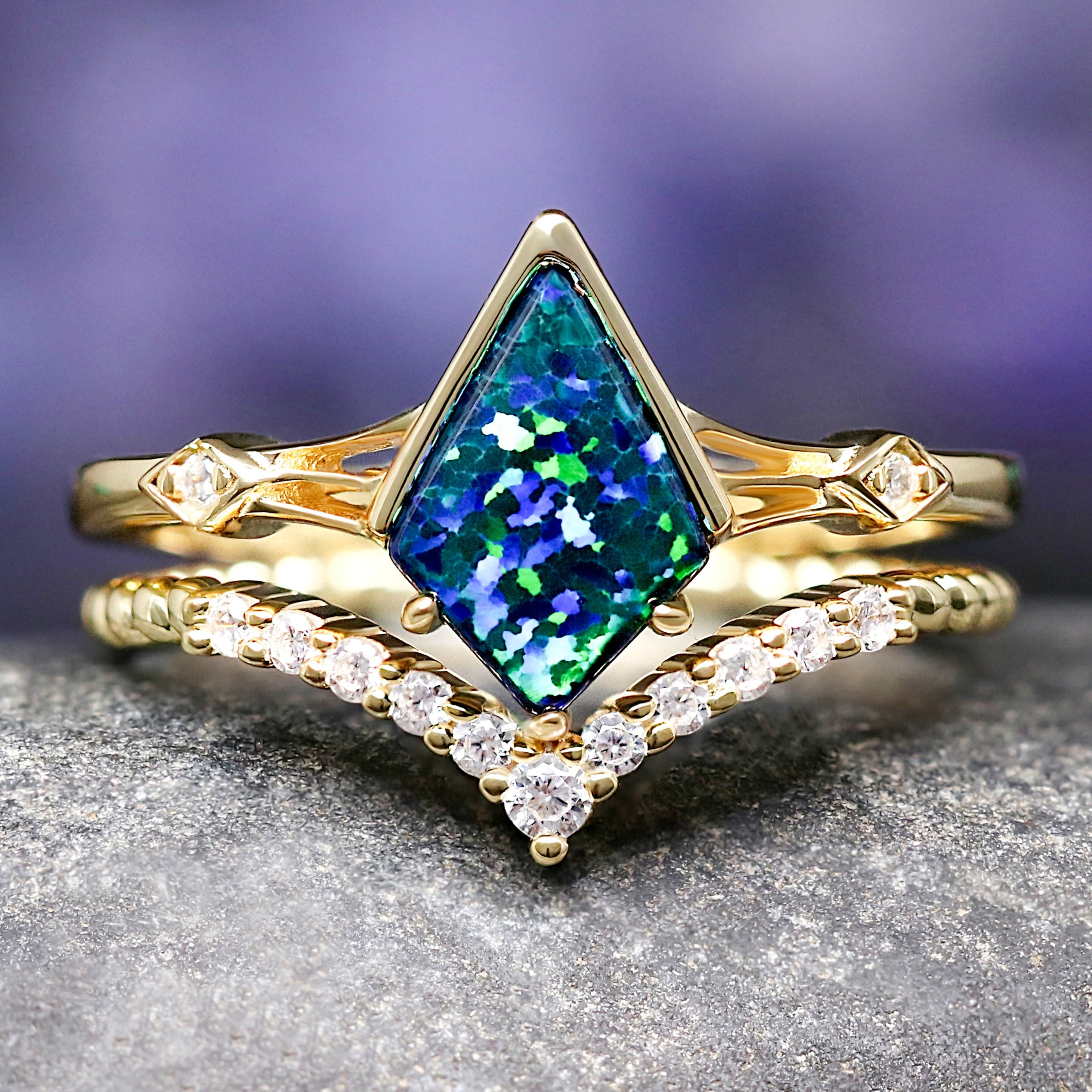 Gold engagement ring with a green emerald opal.