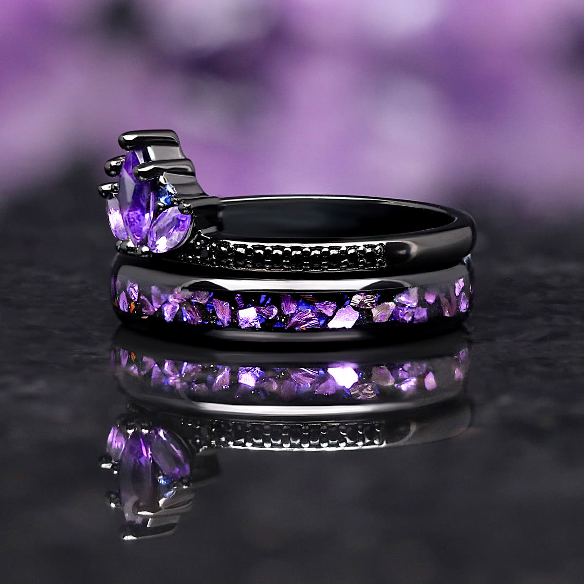 Side view of the amethyst engagement ring and its matching purple crushed-stone stacking ring