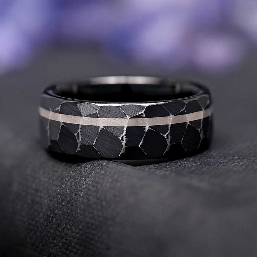 Matte black men’s wedding band with hammered texture