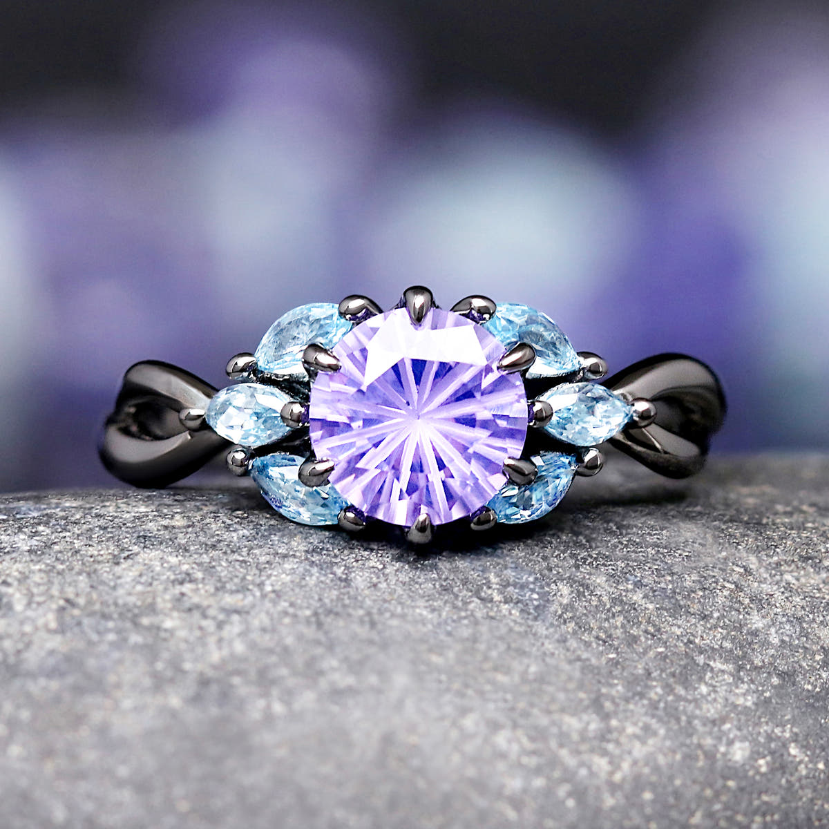 Black sterling silver promise ring with purple and blue gemstones