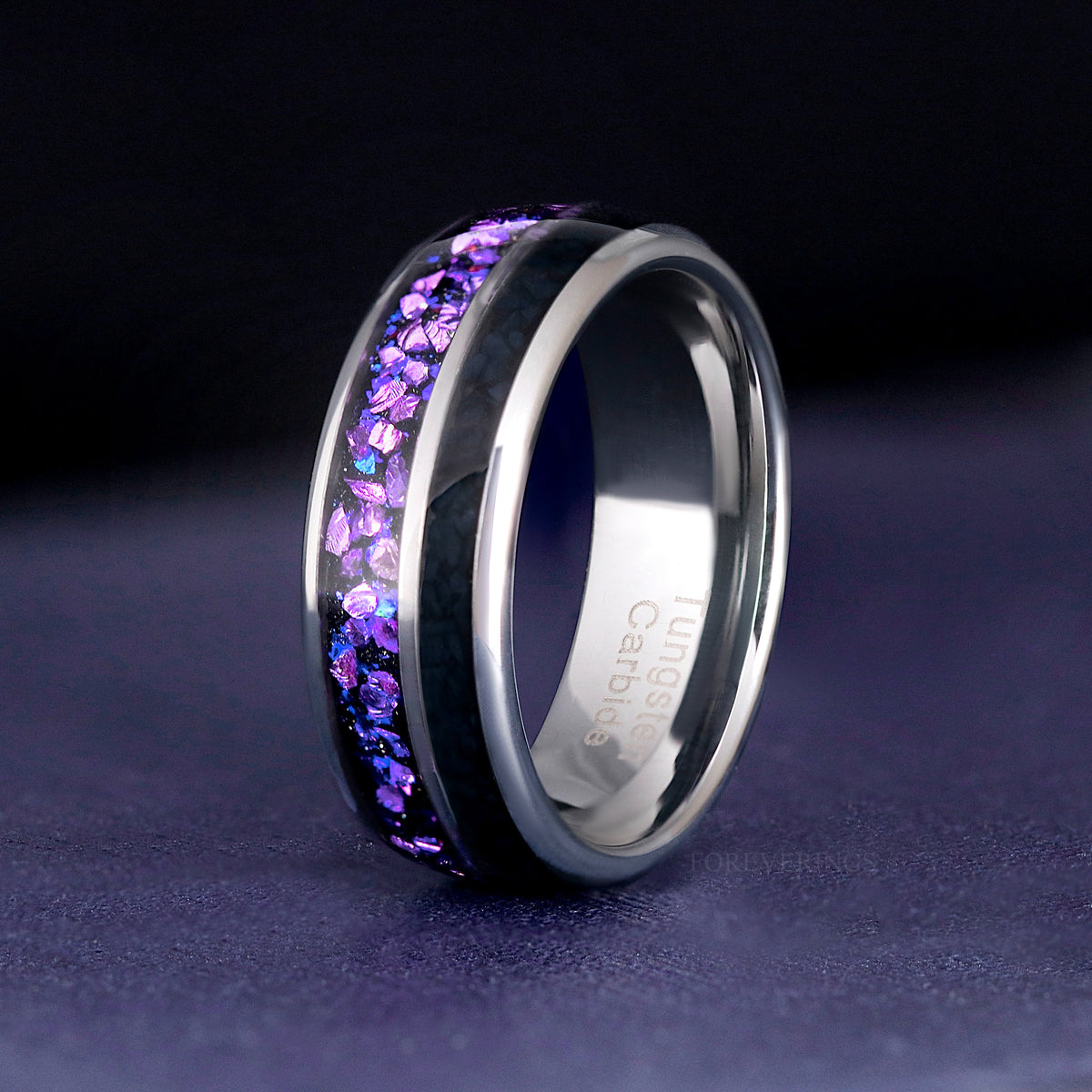 Men's 8mm silver tungsten ring with crushed alexandrite and black onyx inlay, standing upright