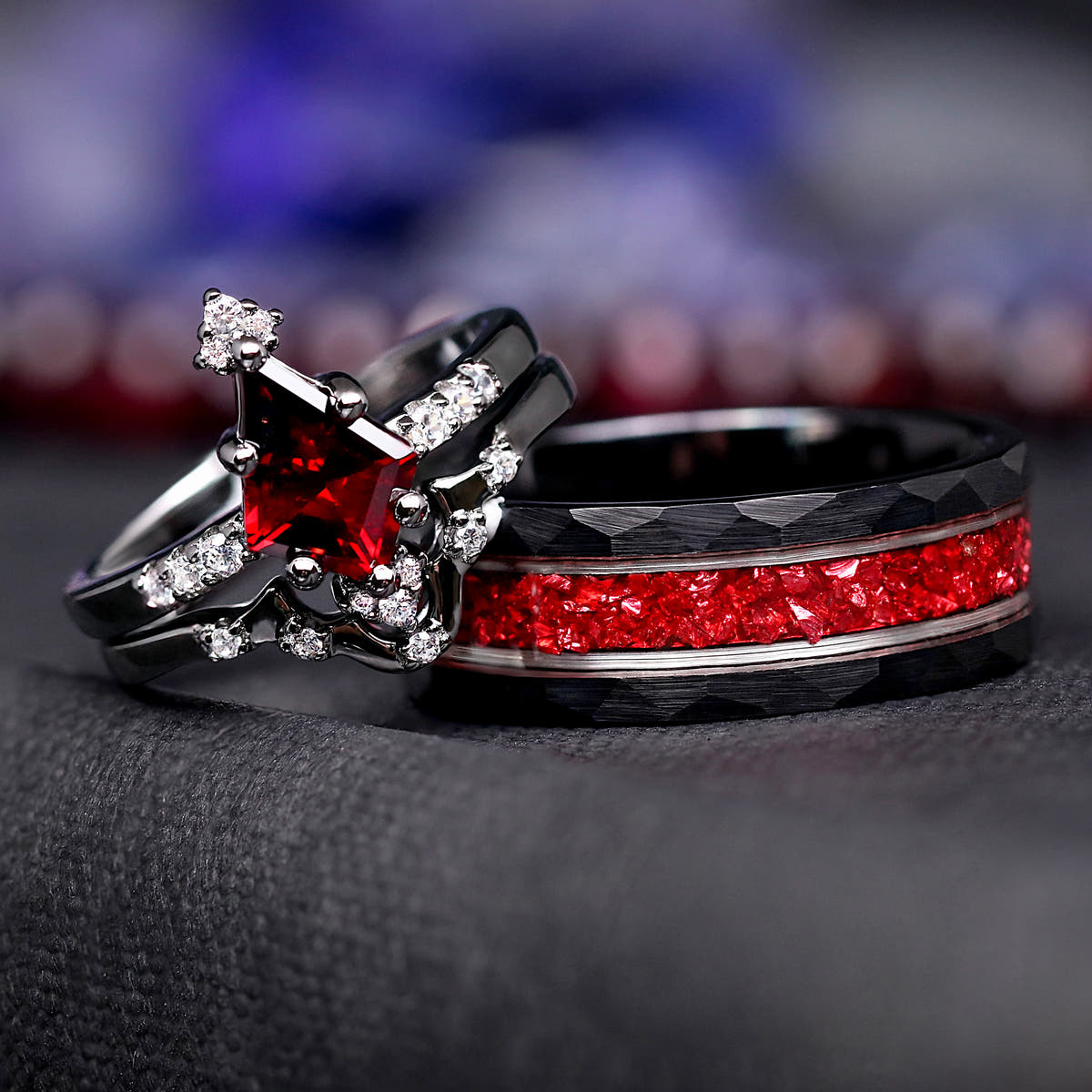 Matching black couples ring set: kite-cut garnet engagement ring, curved band and 8mm tungsten band with crushed garnet inlay