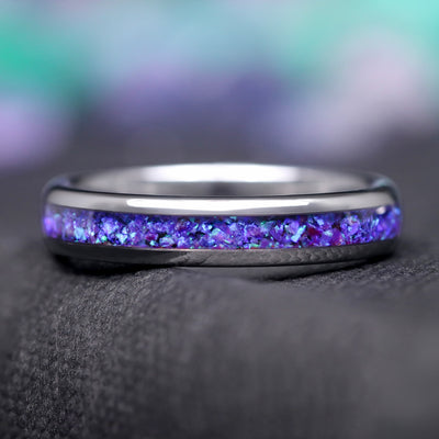 4mm silver tungsten ring with blue aurora opal inlay, lying flat in a front view