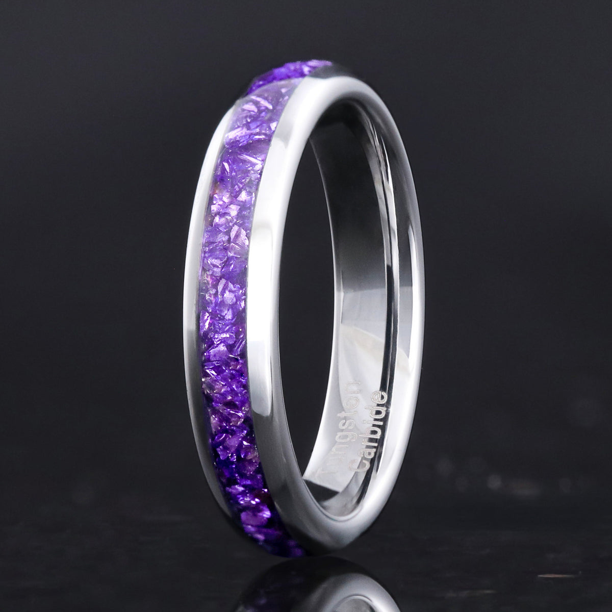 4mm silver tungsten wedding band with crushed amethyst inlay, standing on edge