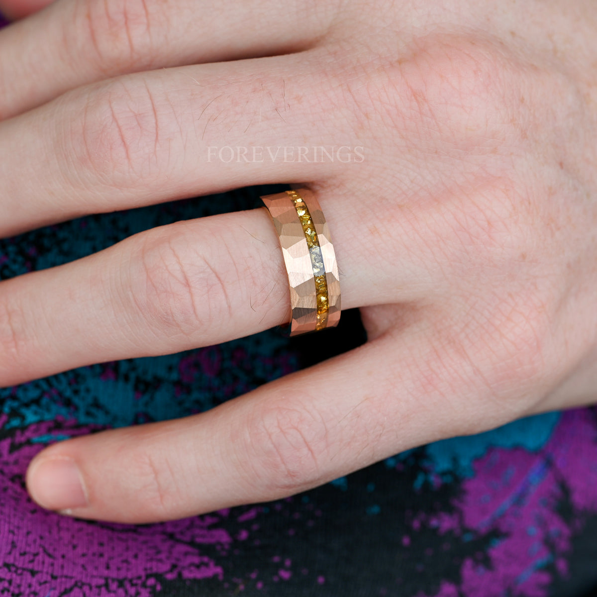 Men's 8mm rose gold hammered tungsten band with crushed citrine, worn on a hand