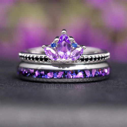 Women's sterling silver amethyst lotus ring stacked on a 4mm silver tungsten band with purple inlay