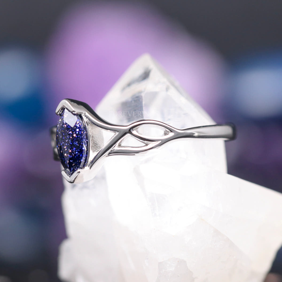 Sterling silver marquise blue sandstone ring, angled side view