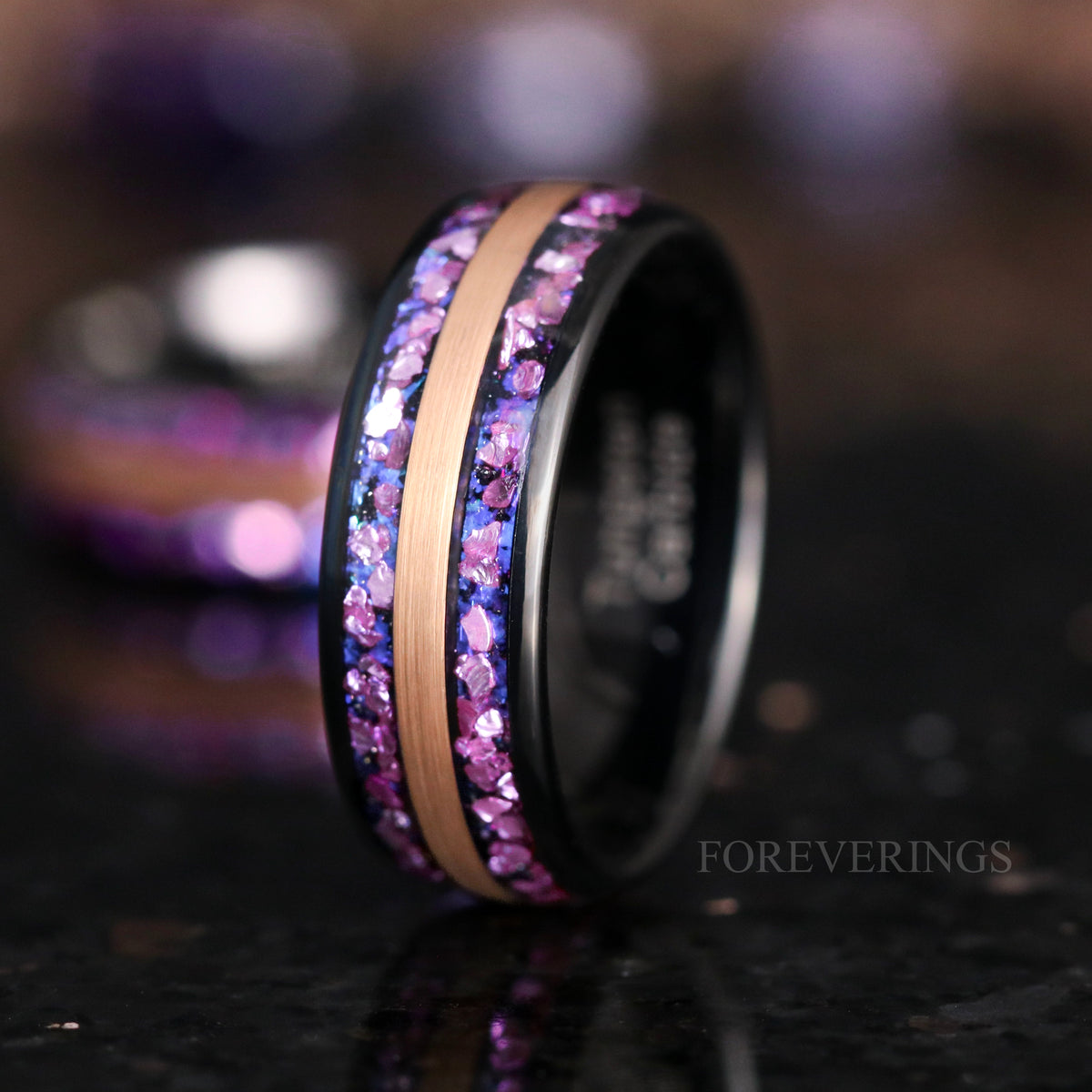 Black and rose gold tungsten alexandrite ring angled to show the polished black interior