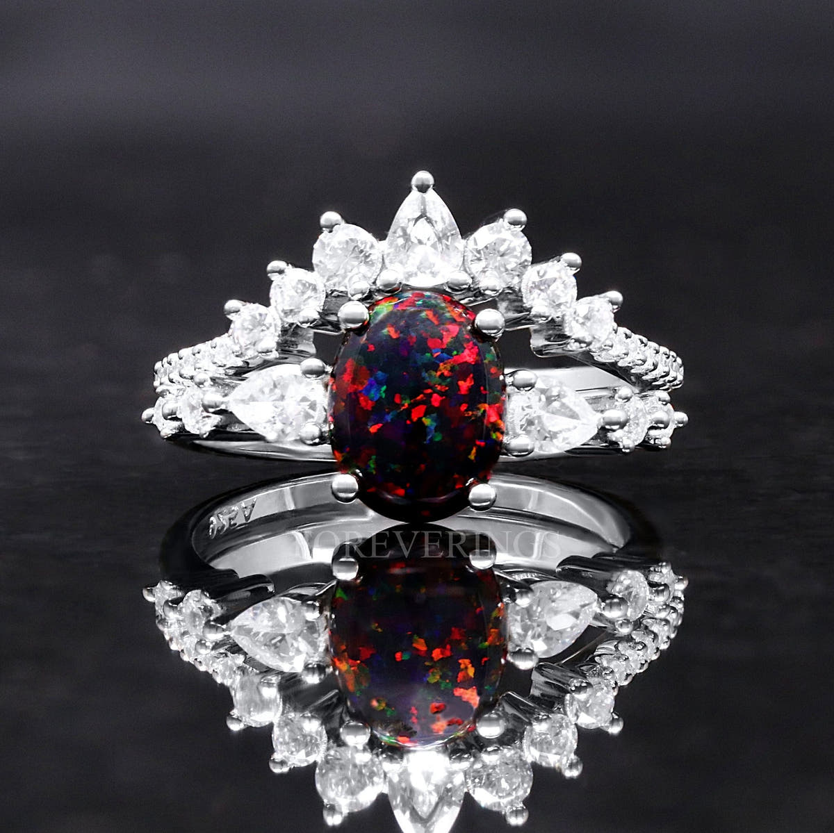 Women's sterling silver bridal set with an oval black fire opal and a crown of clear stones, front view