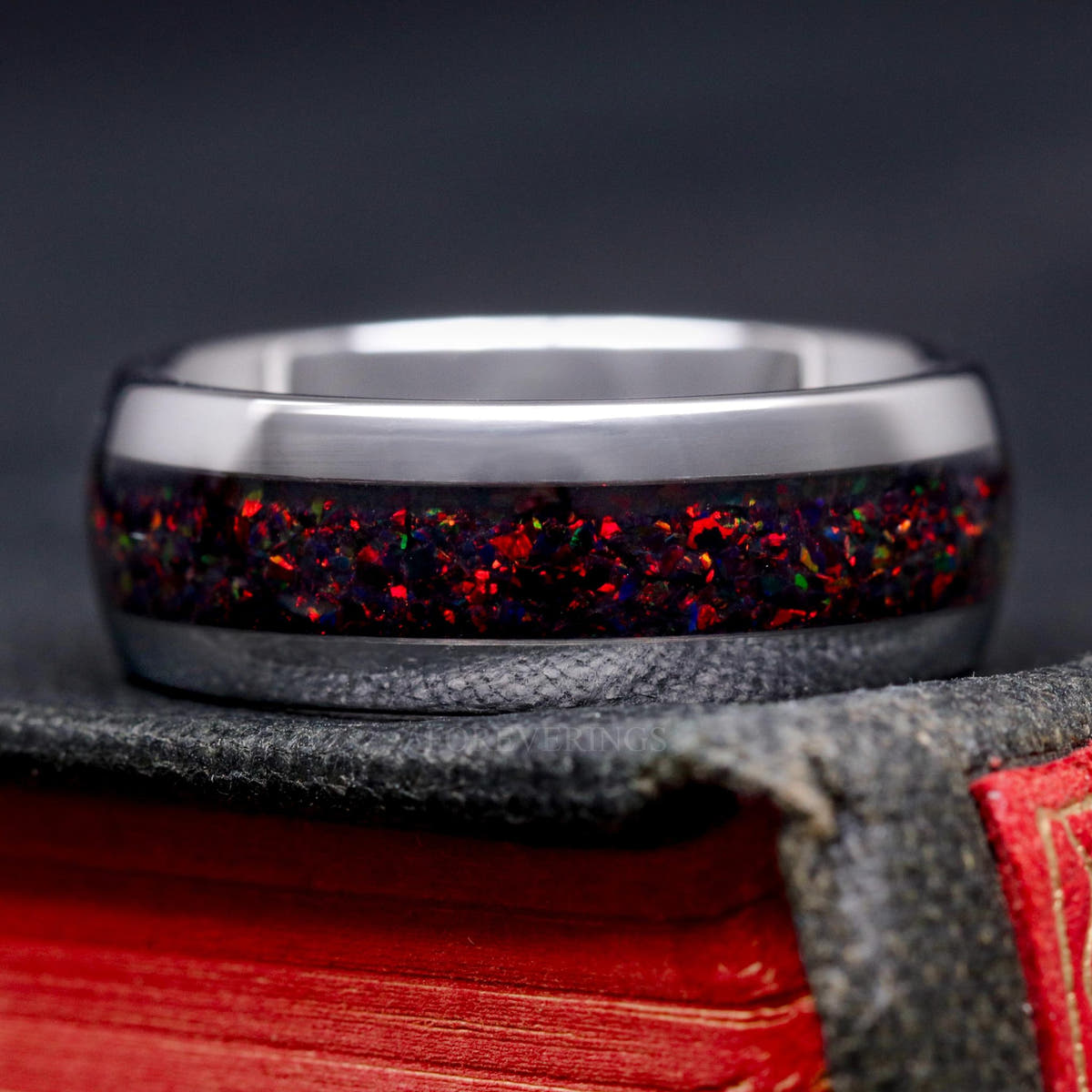 Men's silver tungsten band with black fire opal inlay, shown straight on
