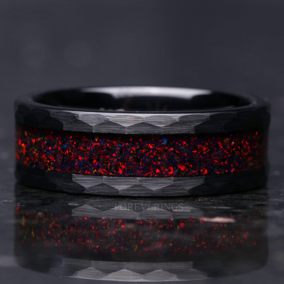 Crushed black fire opal inlay close-up on hammered black tungsten band