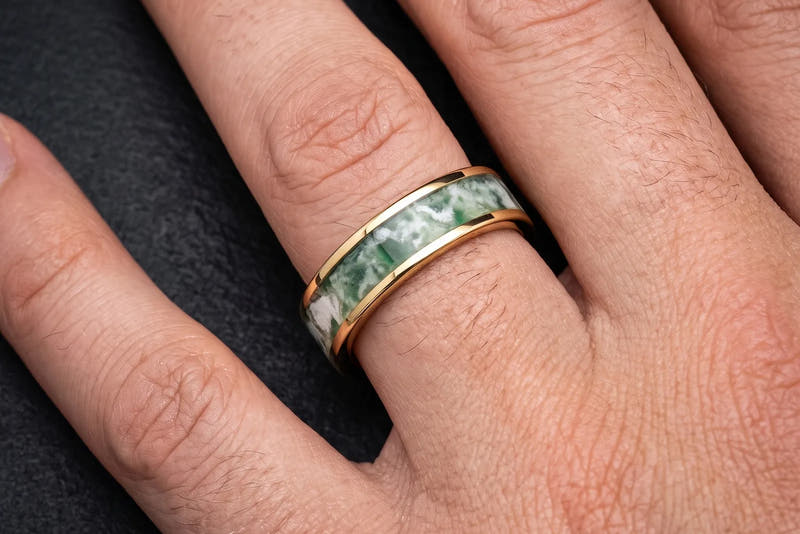 Gold moss agate men's wedding band on hand