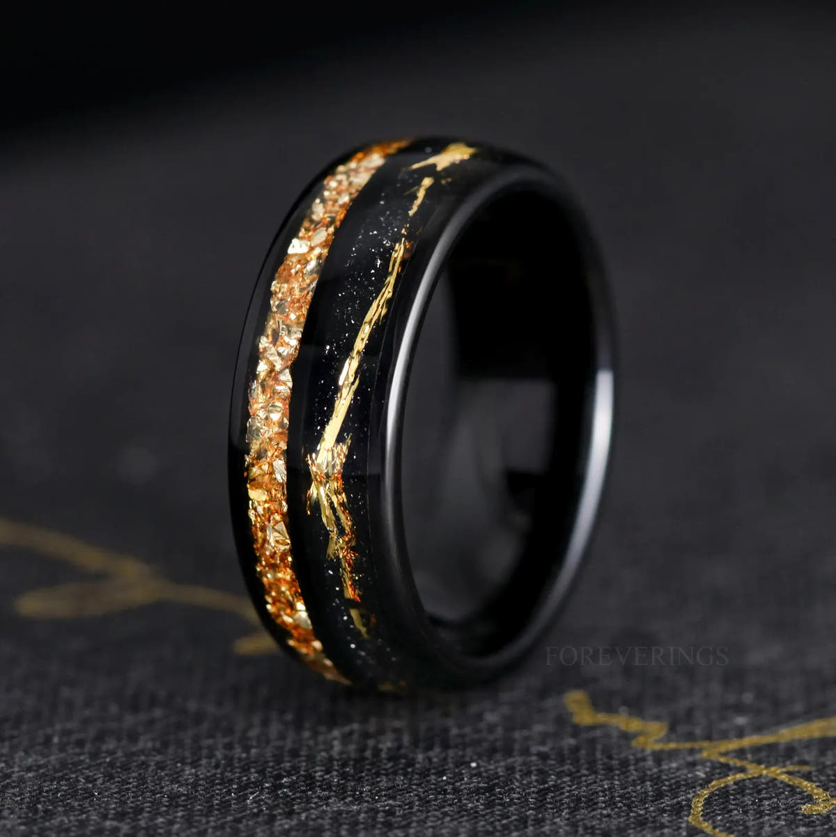 Men's 8mm black tungsten band with citrine inlay and a thin gold line, angled view