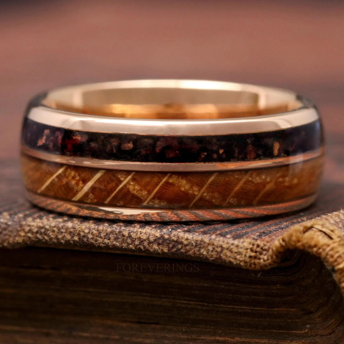 8mm rose gold tungsten whiskey barrel band shown straight on, coffee grind stripe on top