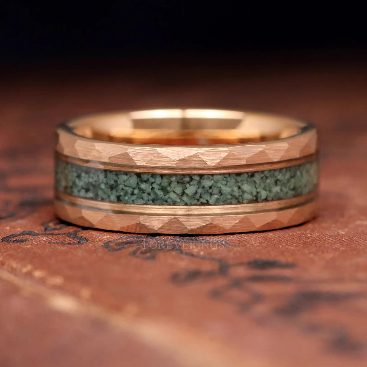Men's rose gold tungsten moss agate ring standing upright, straight-on view of the inlay