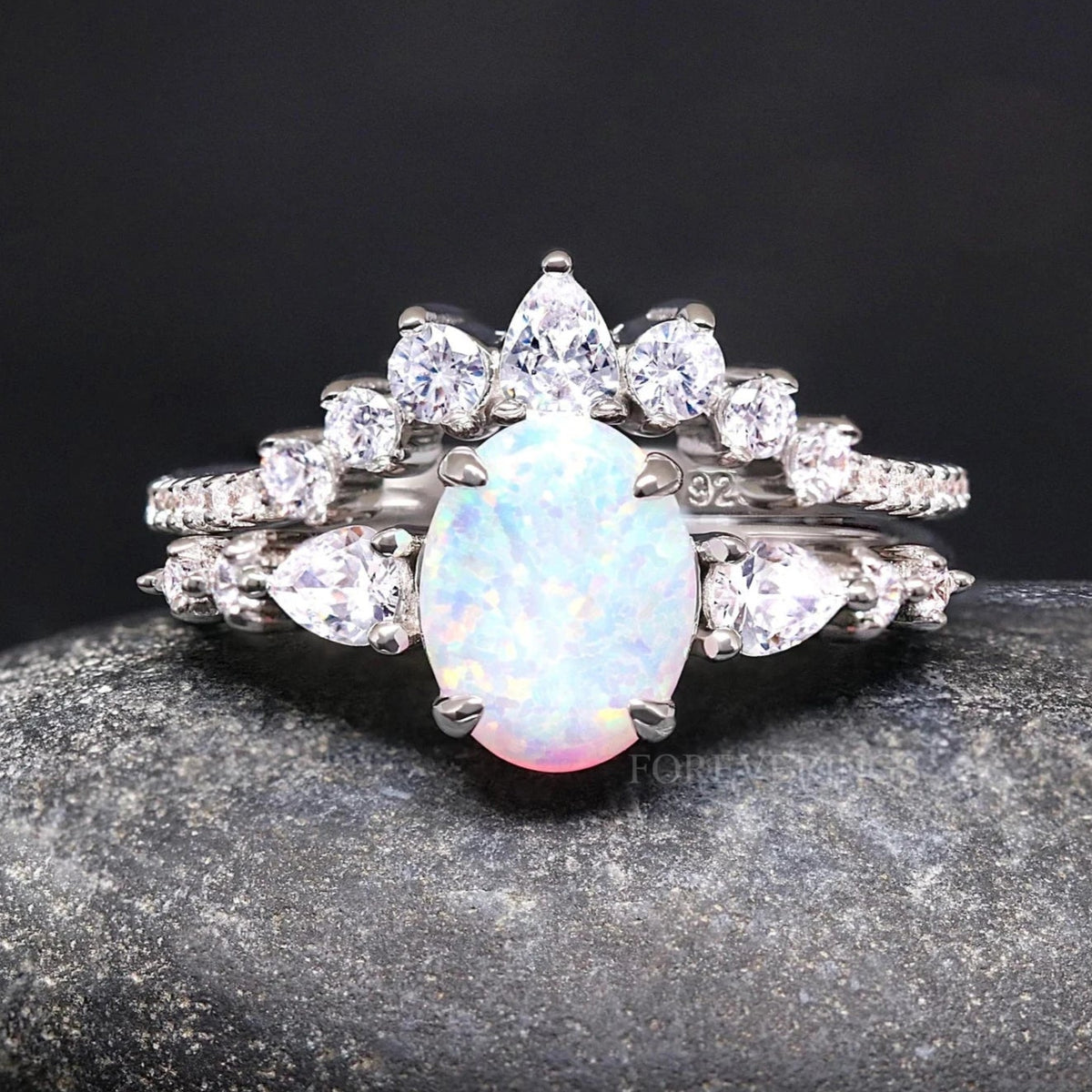 Women's vintage white fire opal bridal set in sterling silver, oval opal ring with a crown-style band