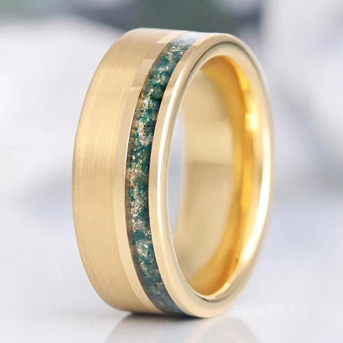 Men's 8mm matte gold tungsten ring with an offset green moss agate inlay, standing upright