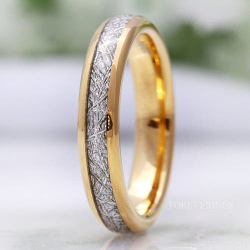 4mm gold tungsten wedding band with a meteorite-look inlay, standing at an angle