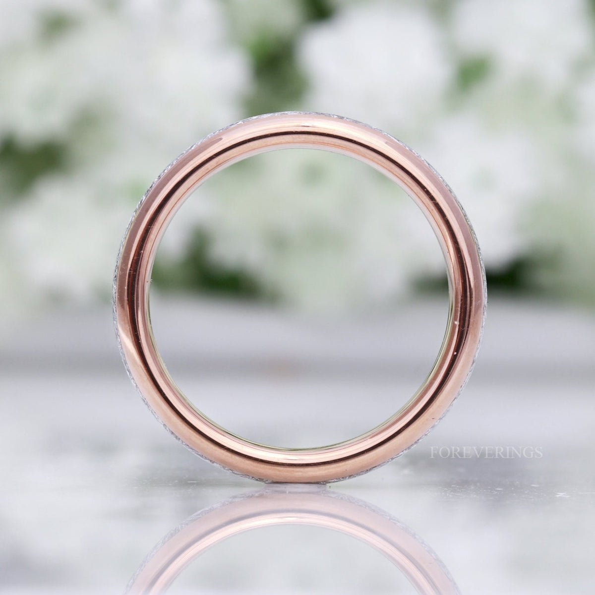 Rose gold tungsten meteorite-look band viewed head-on through the center
