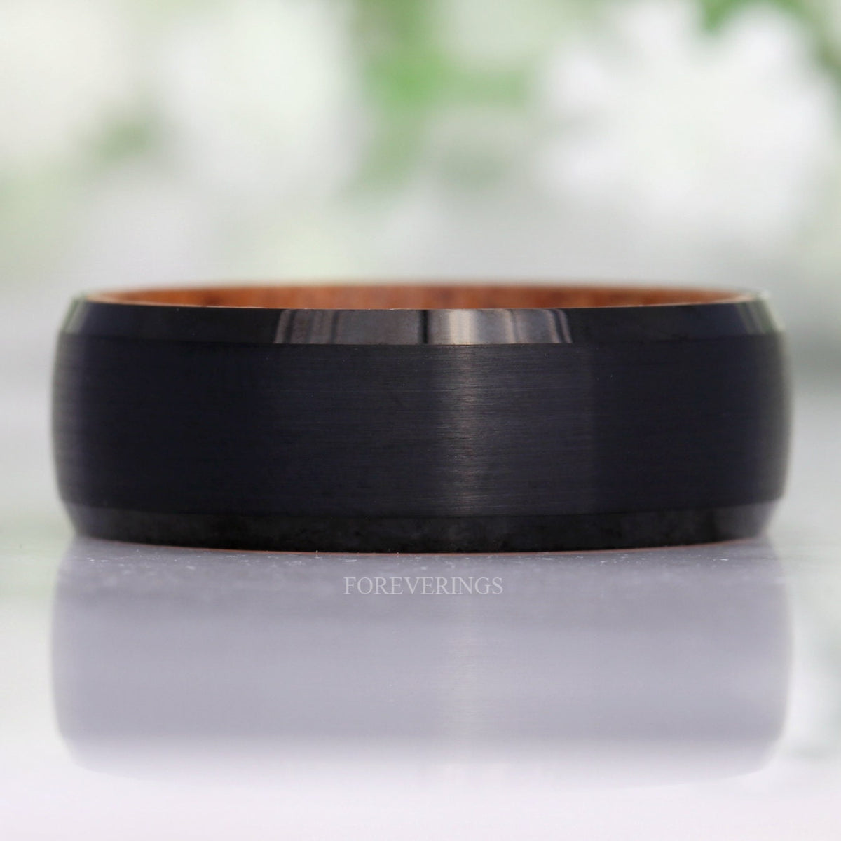 Brushed black tungsten whiskey barrel band shown straight on with beveled edges