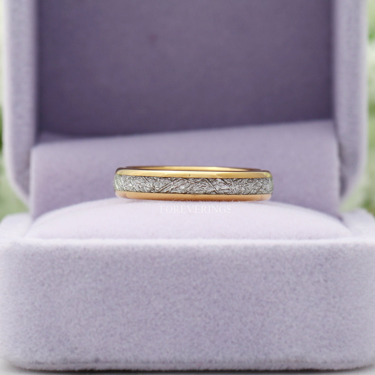 Gold tungsten meteorite-look band in a lavender velvet ring box