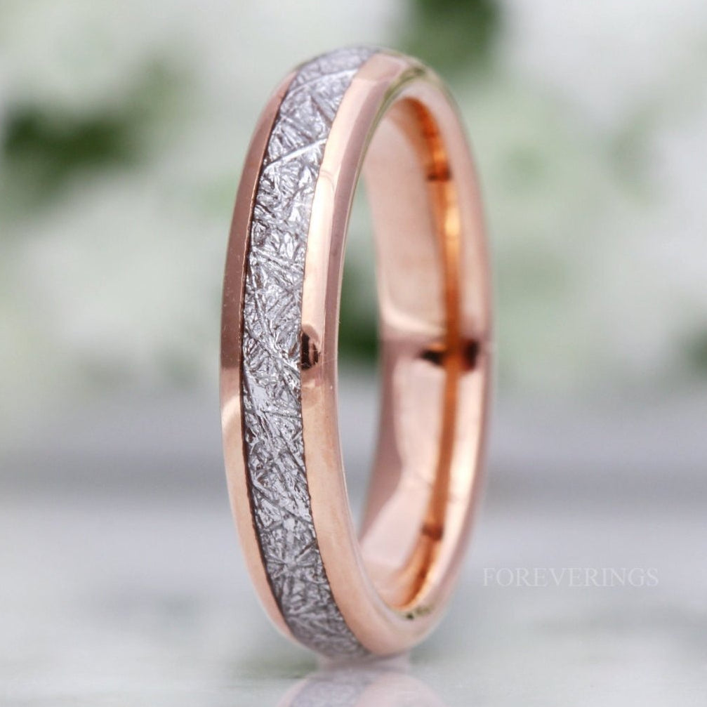 4mm rose gold tungsten wedding band with meteorite-look inlay, standing close-up