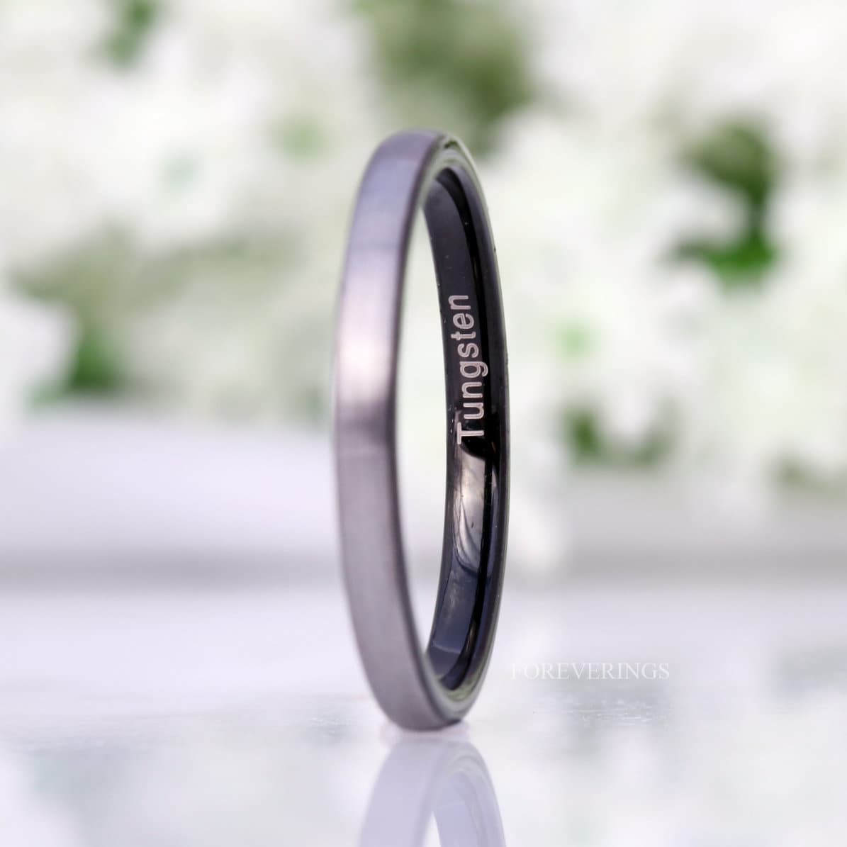 2mm matte silver and black tungsten band angled to show the black interior