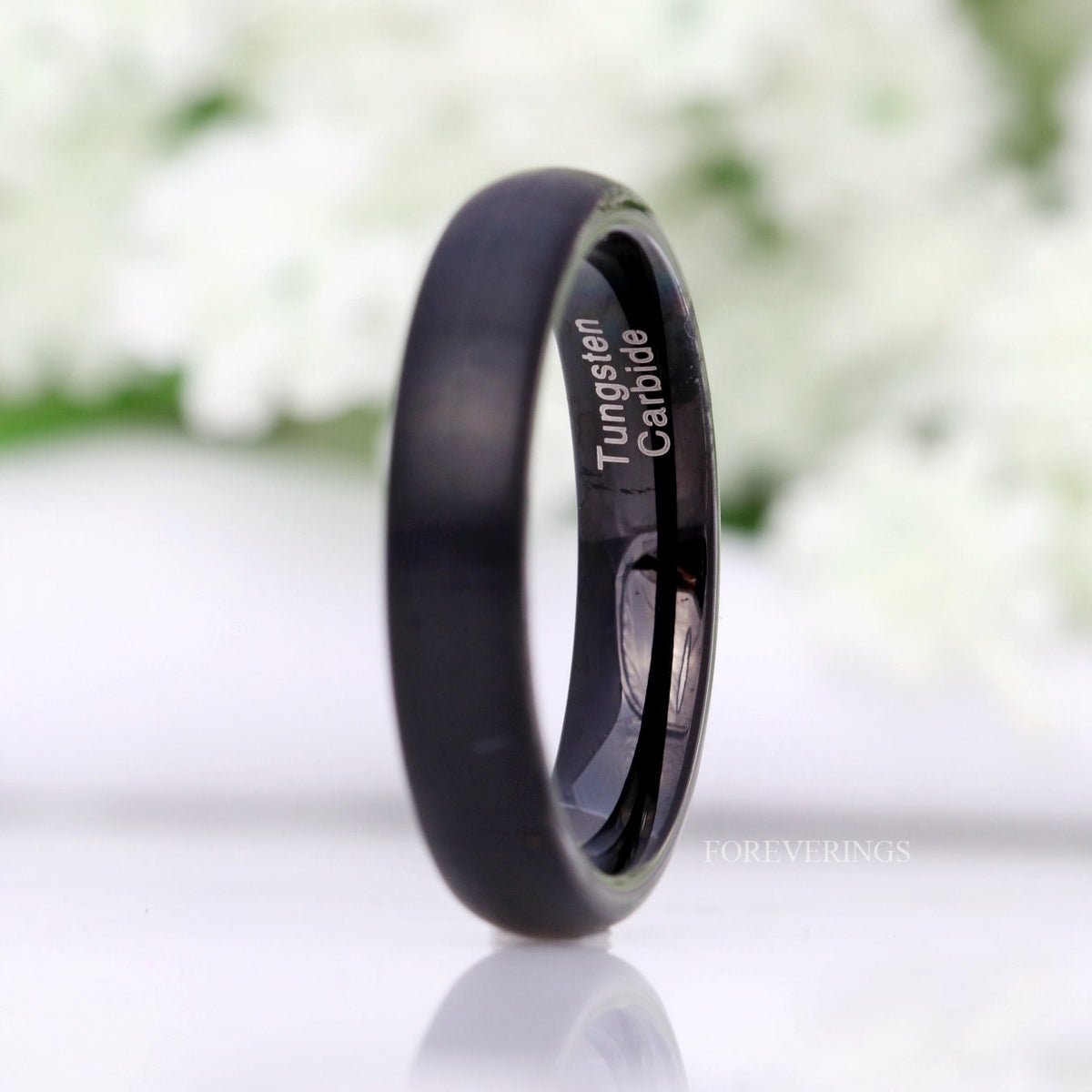 4mm matte black tungsten band angled to show the polished black interior