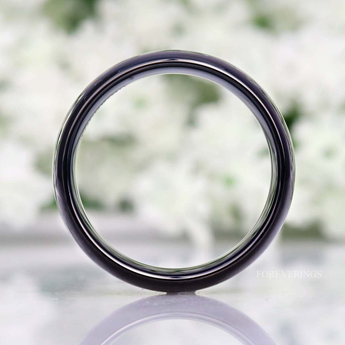 Side view of the 8mm black tungsten band, looking through the ring