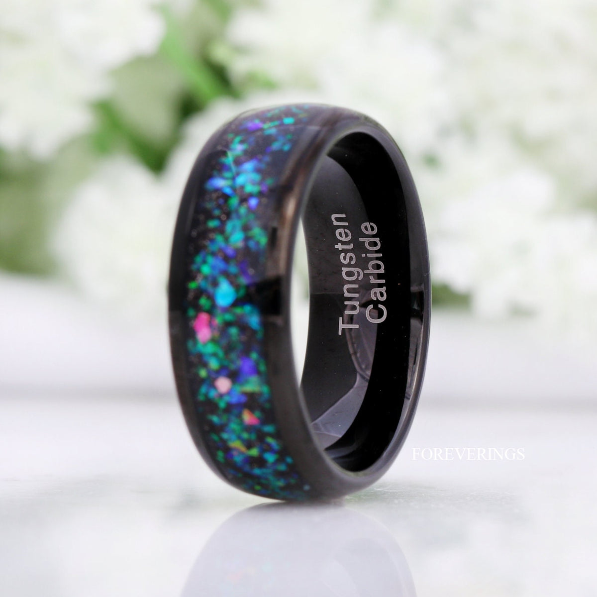8mm galaxy opal tungsten ring angled to show the polished black interior