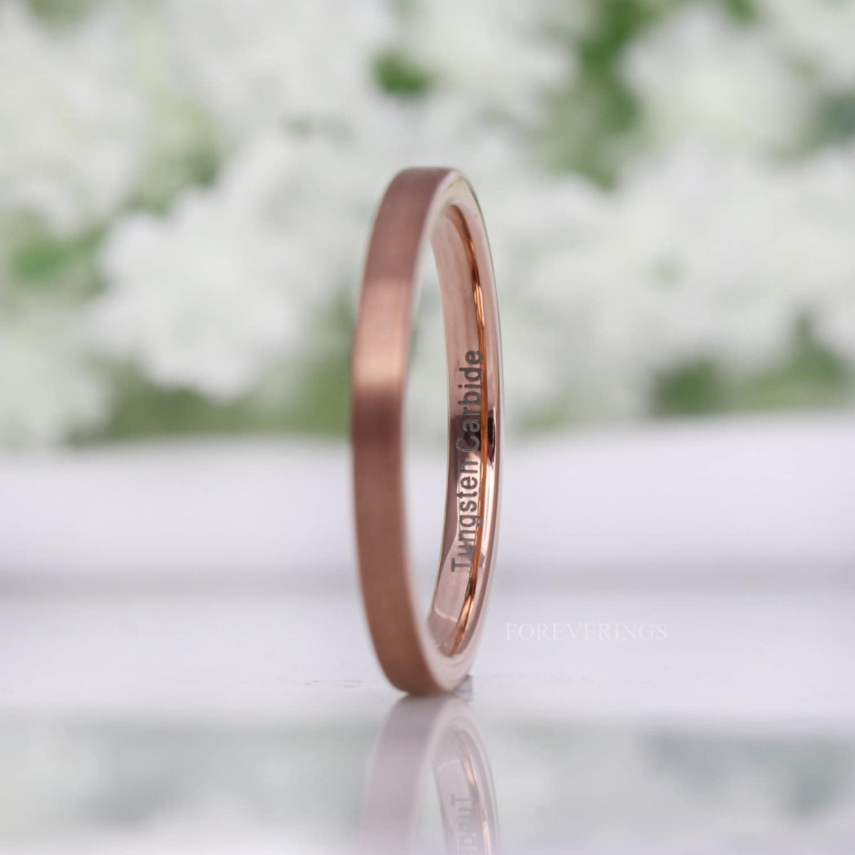 2mm matte rose gold tungsten band turned to show the shiny rose gold interior