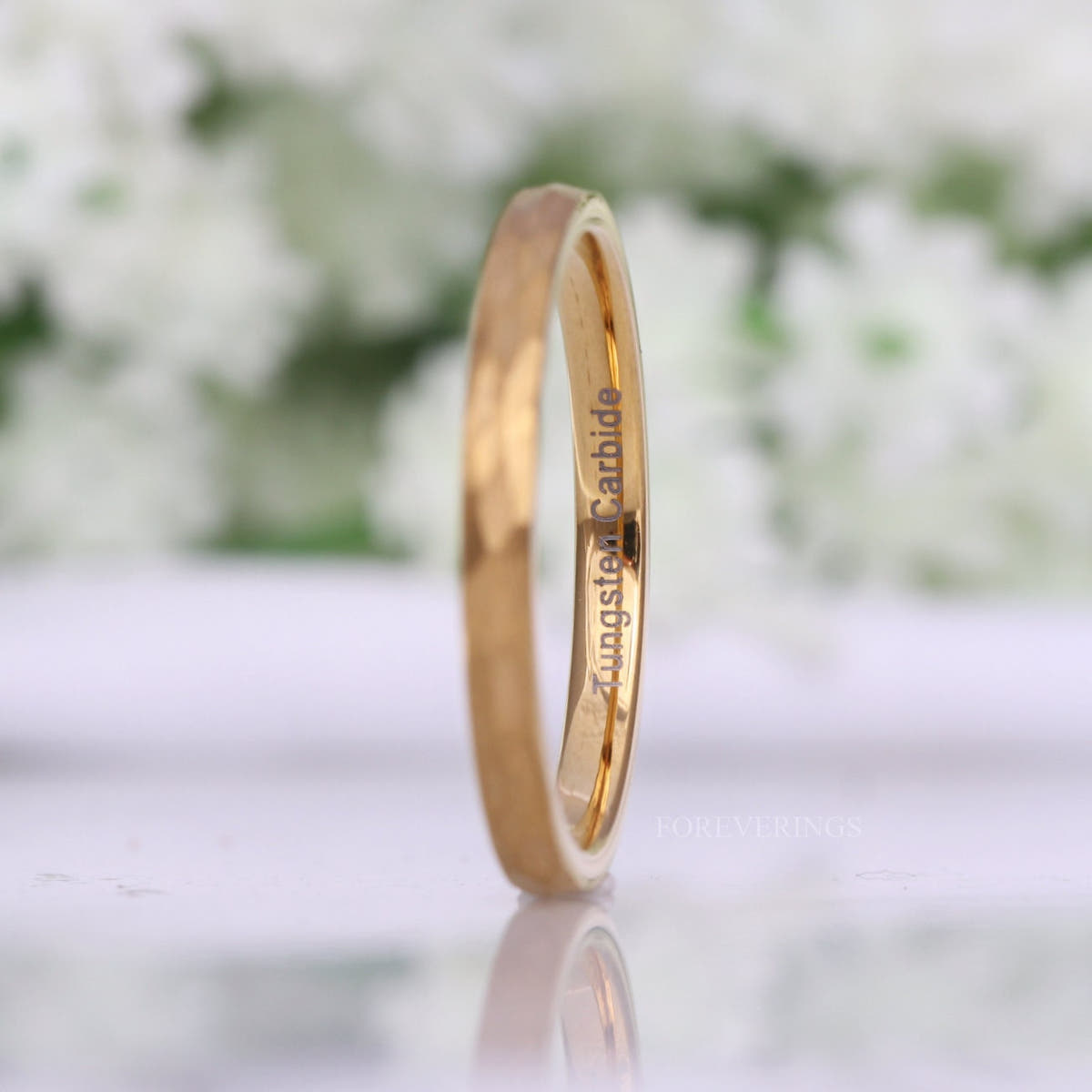 2mm hammered gold tungsten band angled to show the polished gold interior