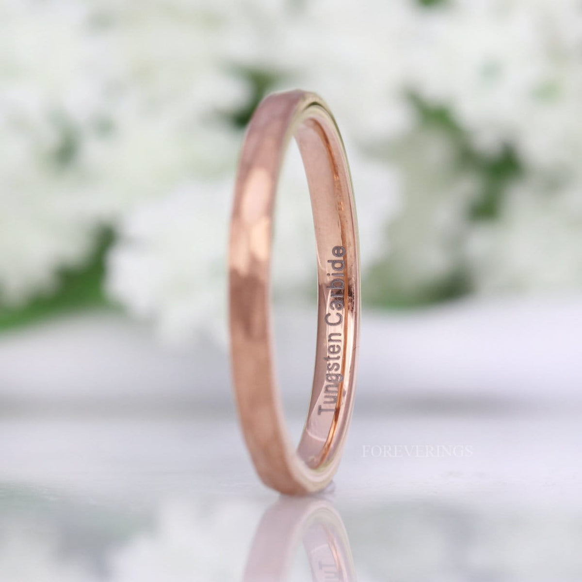 Thin hammered rose gold band angled to show the polished interior