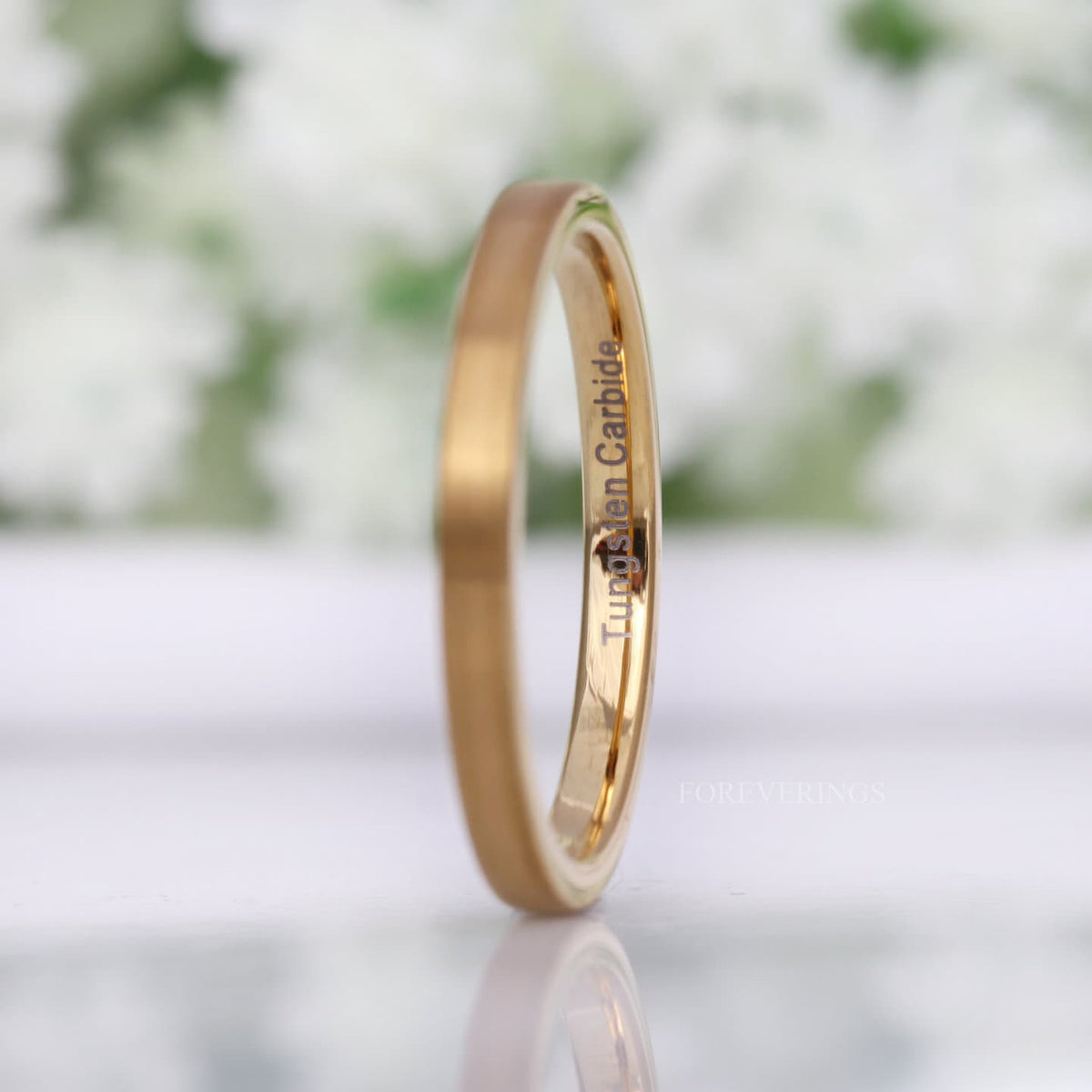 2mm matte gold tungsten band angled to show the polished interior