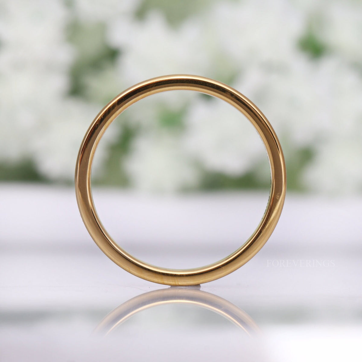 2mm gold tungsten band standing on edge, seen as a full circle