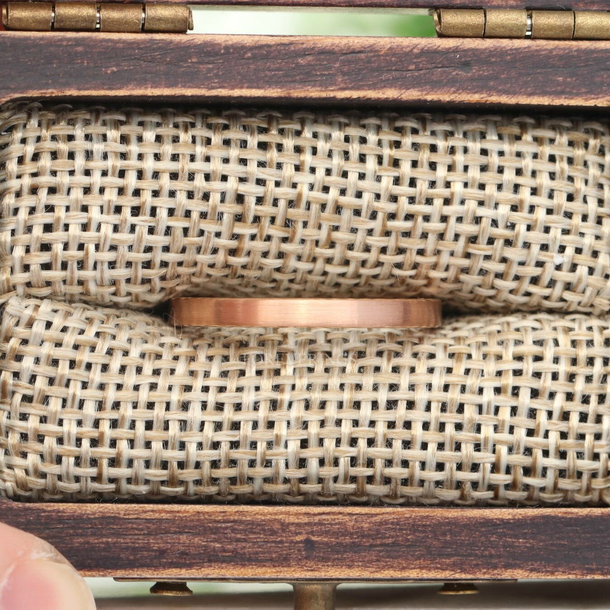 2mm matte rose gold tungsten band in a rustic wood ring box with a burlap insert